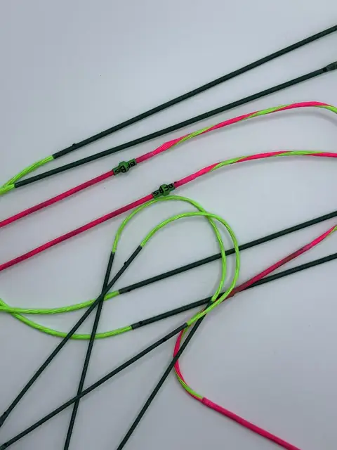 A finished set in Flo Green/Pink with Green serving, coiled on white.