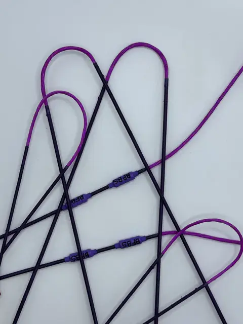 A finished set in Flo Purple with Purple serving, coiled on white.