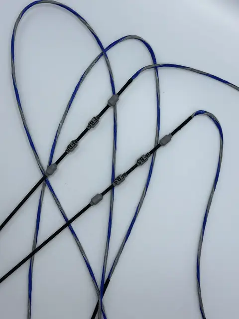 A finished set in Royal Blue/Silver with Black serving, a second set, coiled on white.