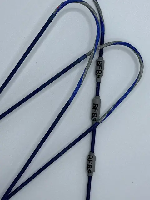 A finished set in Royal Blue/Silver with Black serving, coiled on white.
